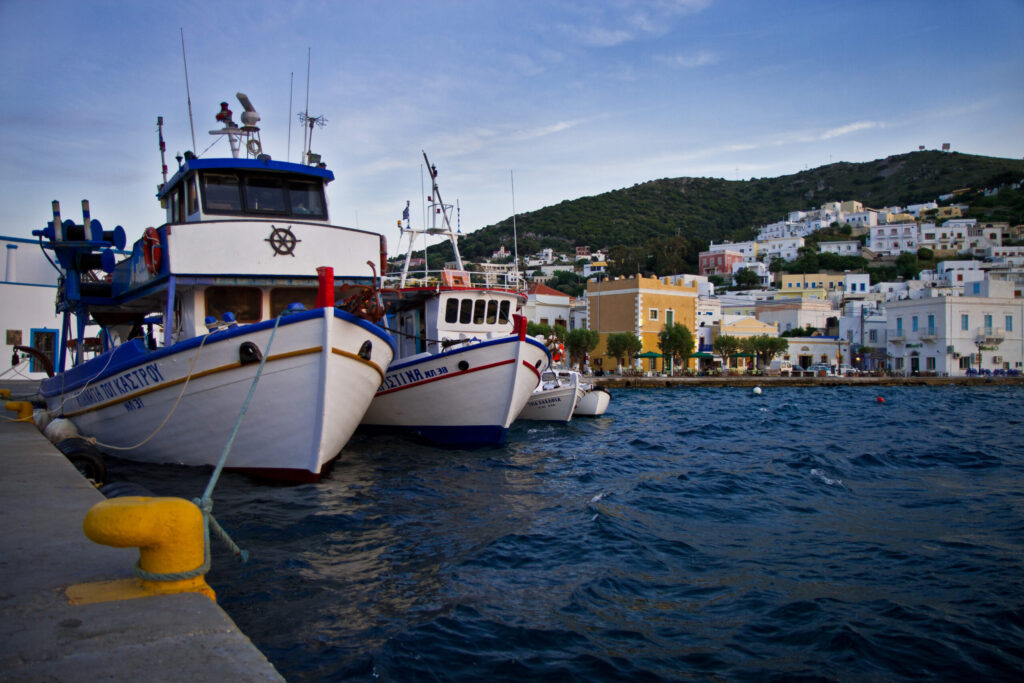 Fishermans and traditional boats in Leros